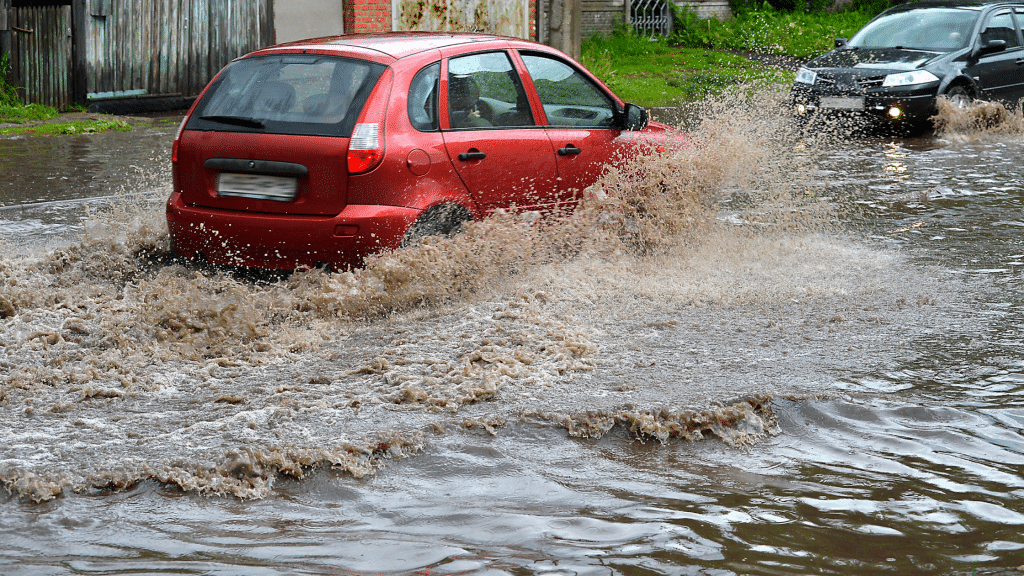 car passing through a flooded street