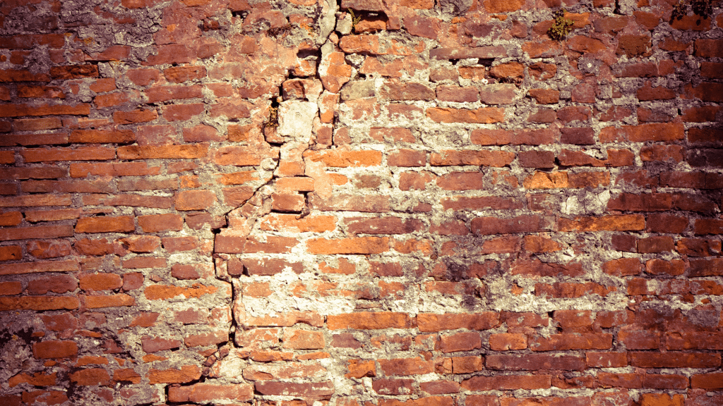 cracks on the brick facade