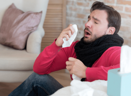 man having allergy symptoms