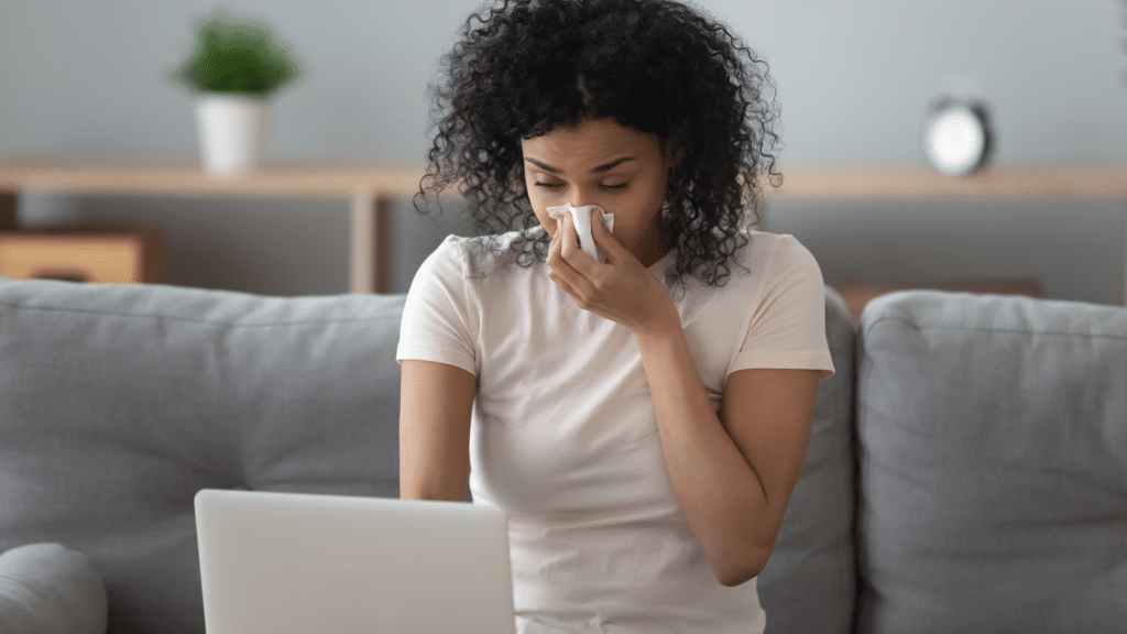 woman having allergy symptoms