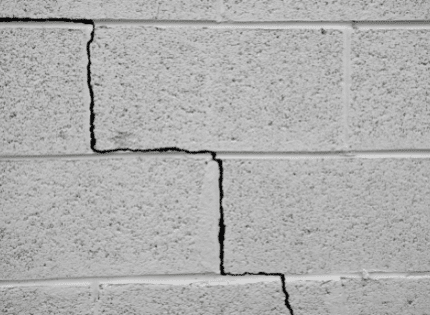 stair step cracks on the brick wall